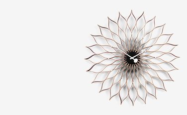 Sunburst wall clock in walnut